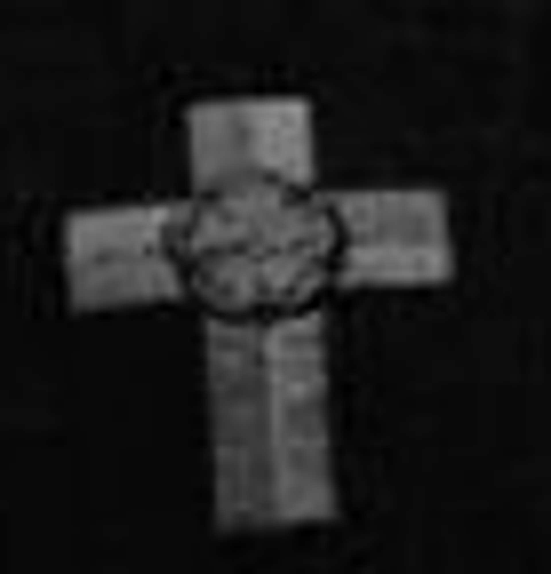 Calvary cross on the chest of Crowley